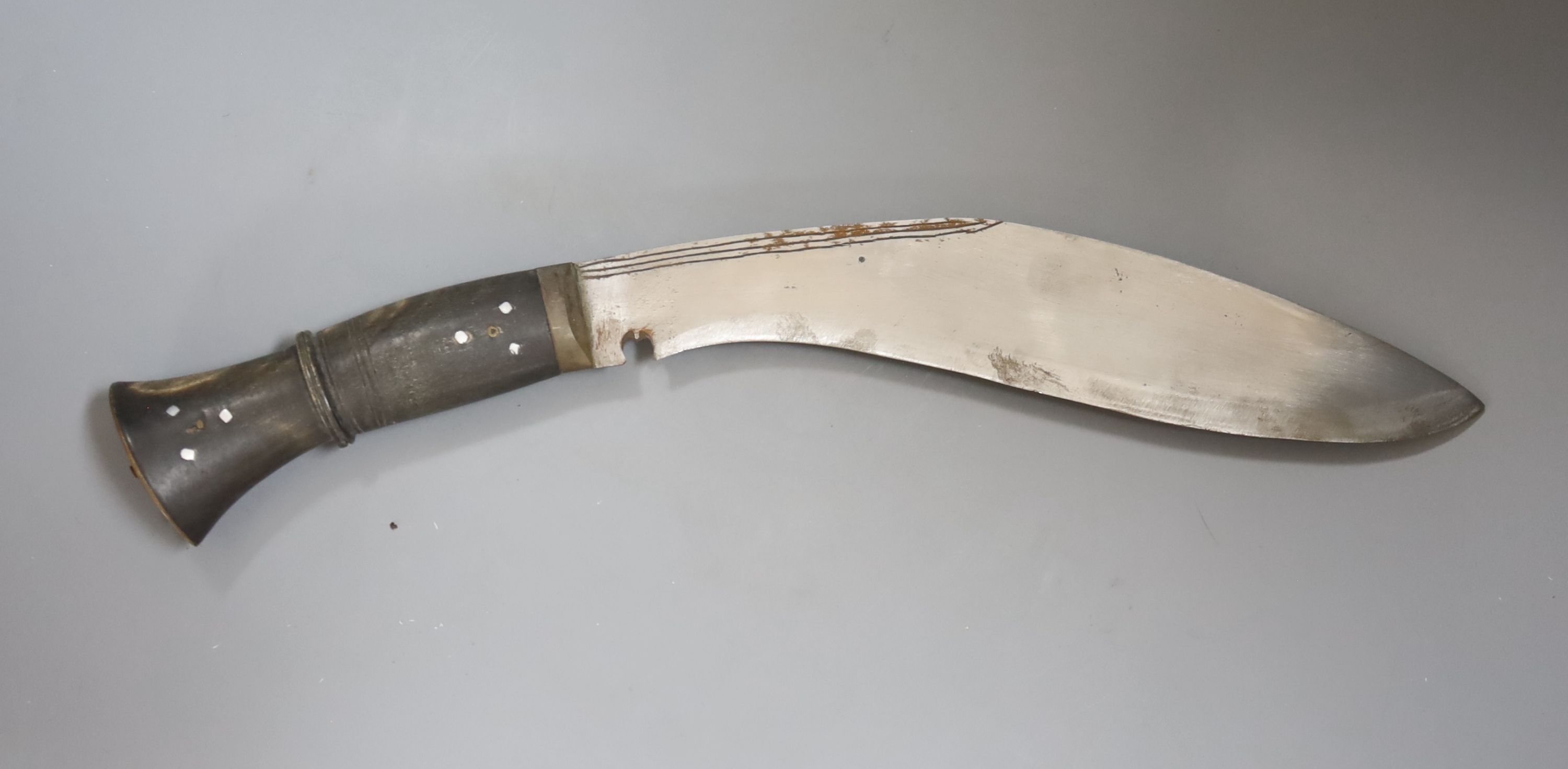 A Nepalese curved kukri with enamel inlaid sheath